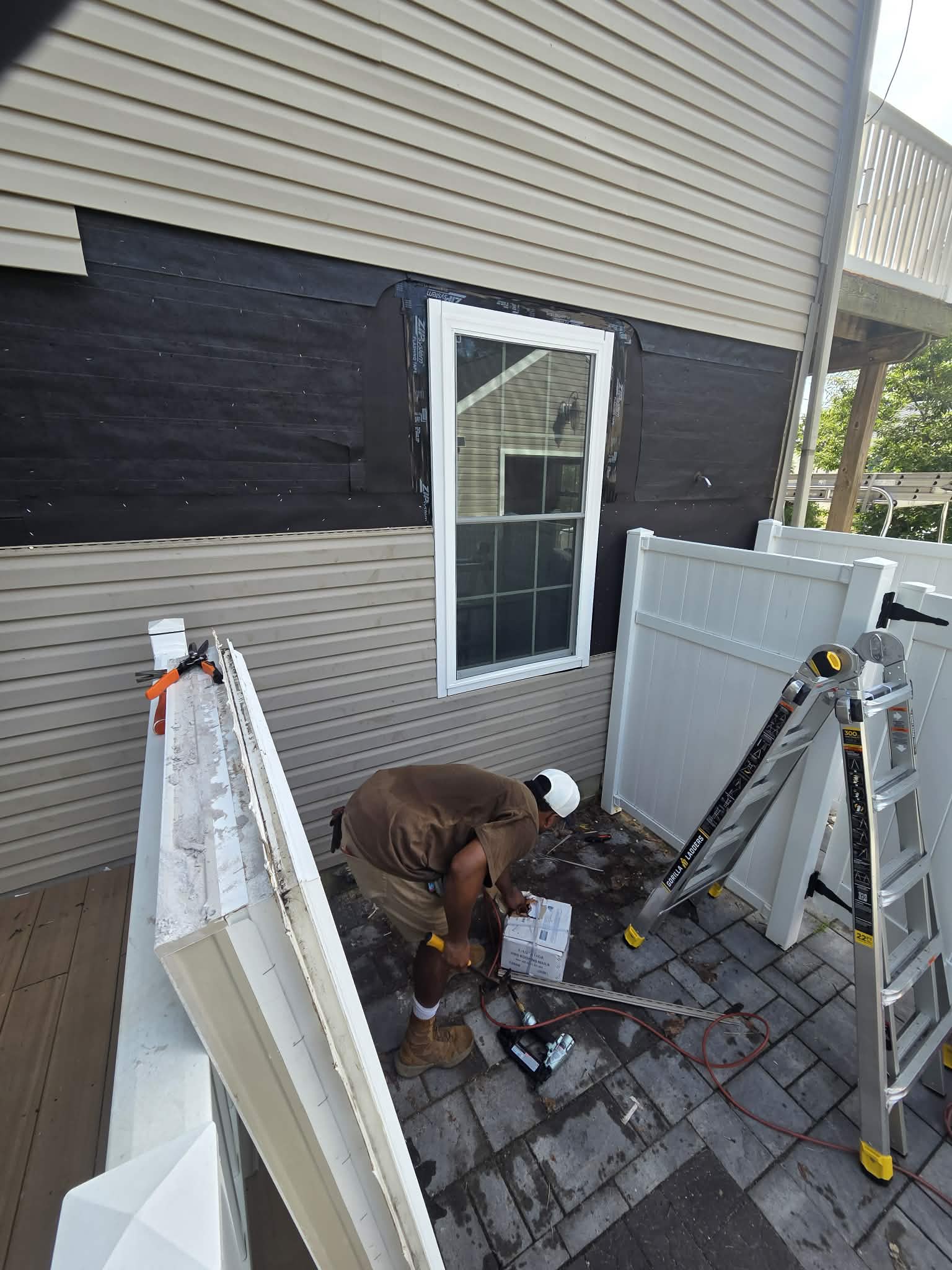 WILDE crew installing new window trim