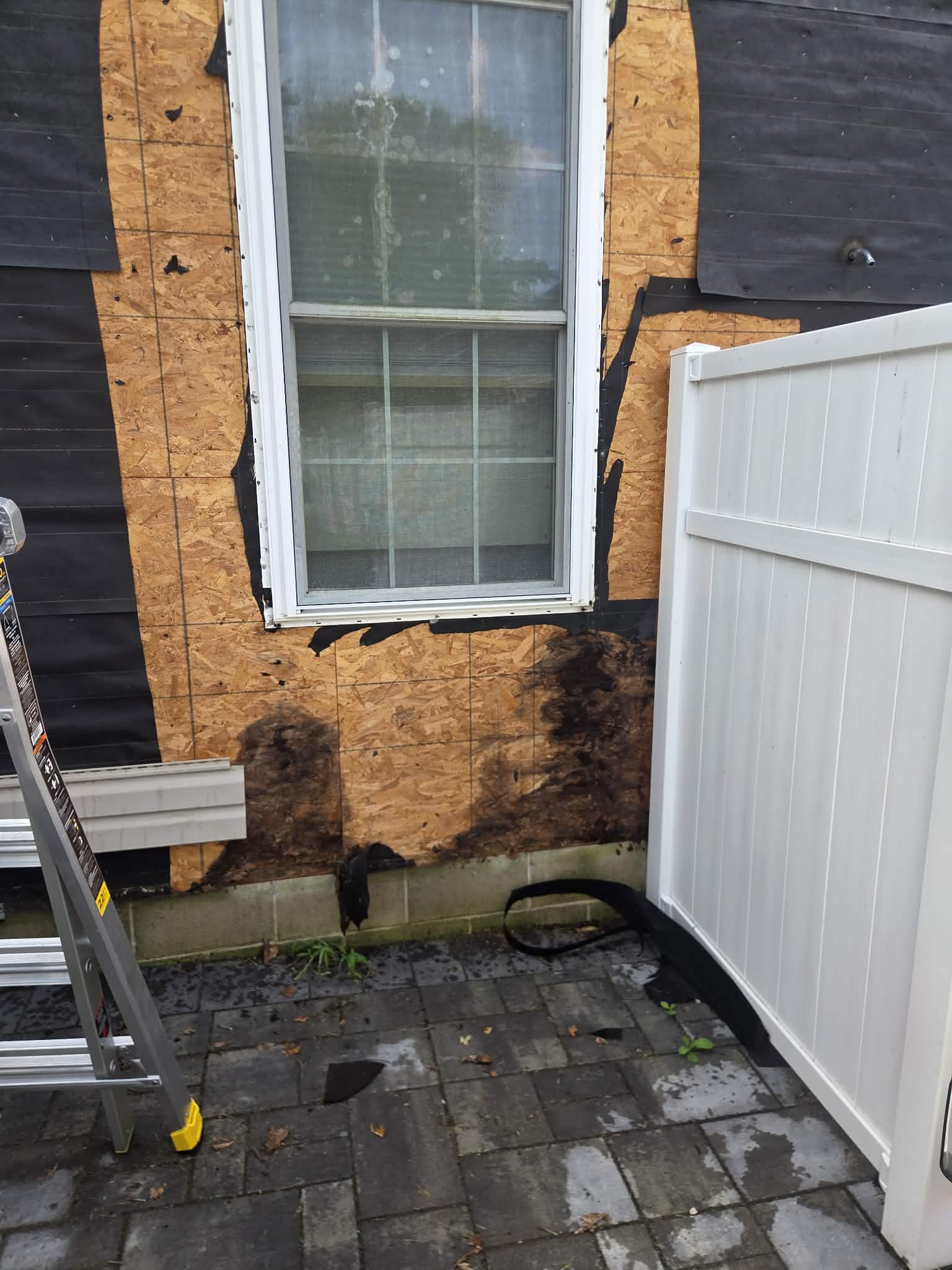 Water-damaged sheathing found and repaired around window